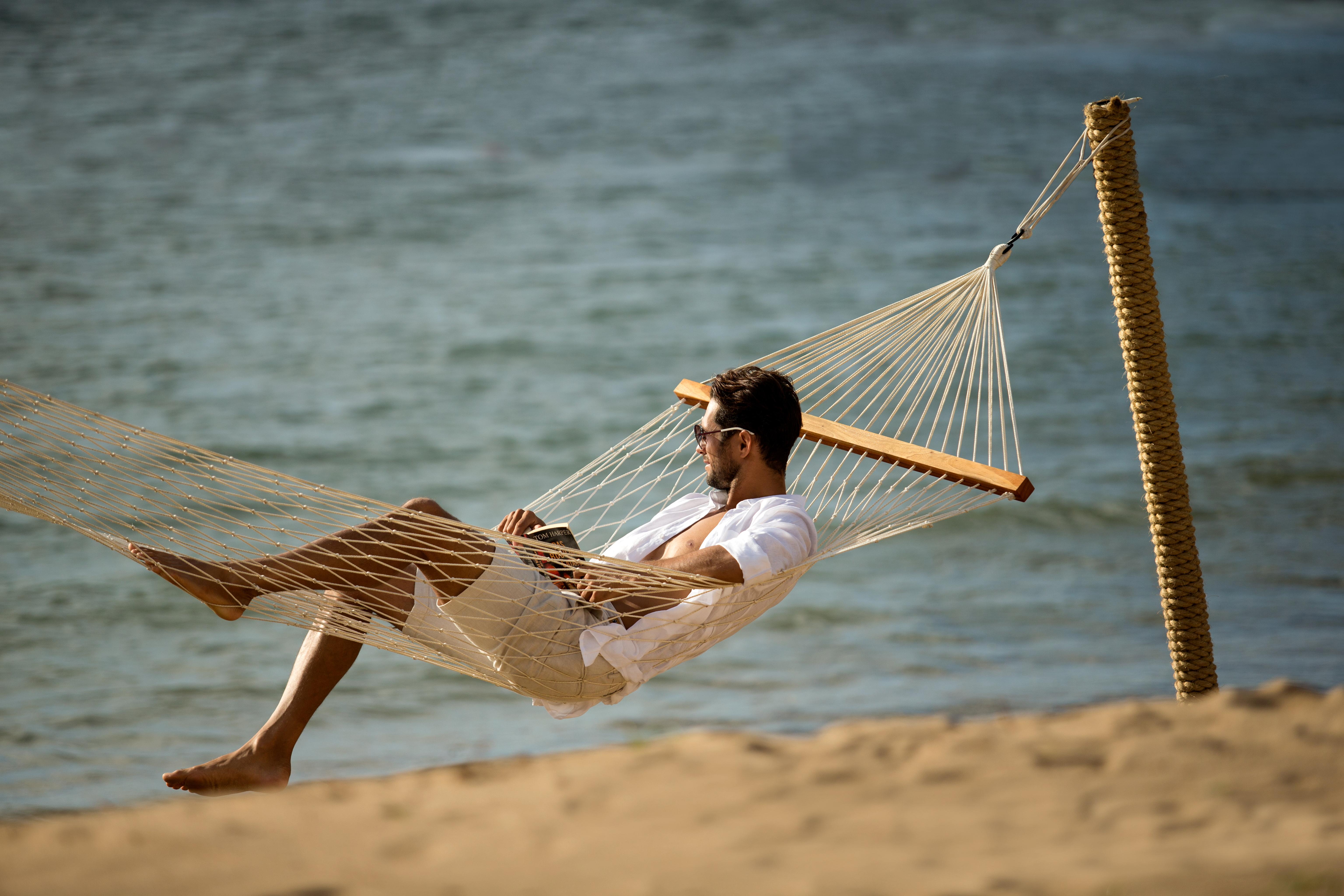 Sadara Resort Nusa Dua (Bali) Exterior foto A man relaxing in a hammock